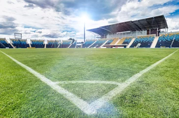 Fotobehang Low angle view of football stadium © moodboard