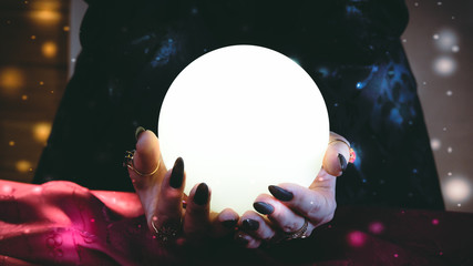 Fortuneteller's hands with a crystal ball. Clairvoyance
