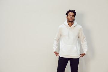 Attractive african american man in hoodie sweater. Mock-up. - obrazy, fototapety, plakaty