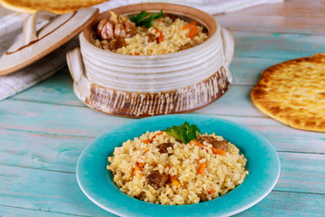 Delicious indian lunch with stewed rice ,meat and carrot.