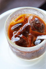 Iced coffee in glass with spoon