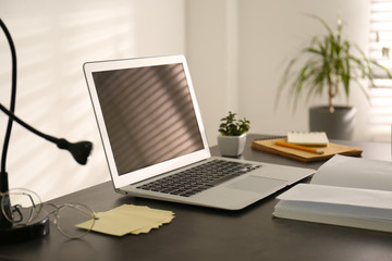 Modern laptop on office table. Stylish workplace