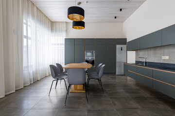 The dining room and kitchen are Scandinavian-style. Spacious. Dining table.