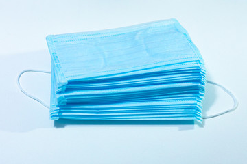 Fototapeta premium medical masks of blue color,disposable protection