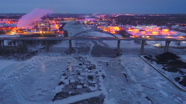 Scenic highway bridge predawn, dynamic aerial view with city lights and traffic. This is the Leo Frigo Memorial Bridge, Green Bay, Wisconsin.