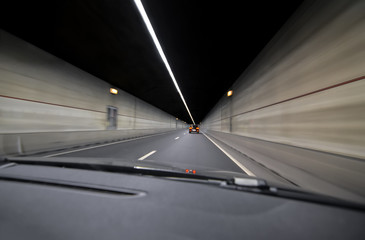 Blurred motion subway moving into tunnel, abstract background