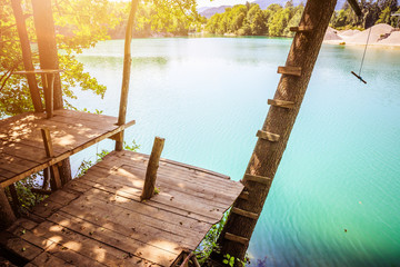 Wooden platform and a beautiful blue lake, playground