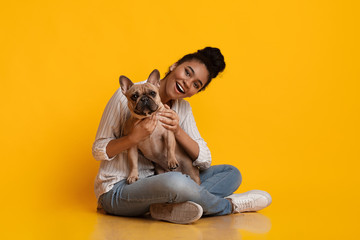 Young Beautiful Afro Woman Posing With Ger Cute Dog In Studio