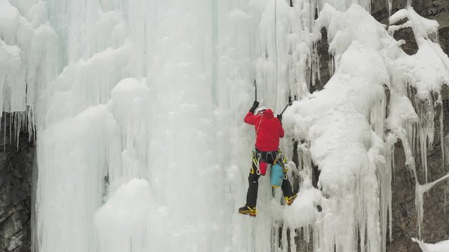 Climber scales huge ice cascade Maineline, Kineo Mountain 4K