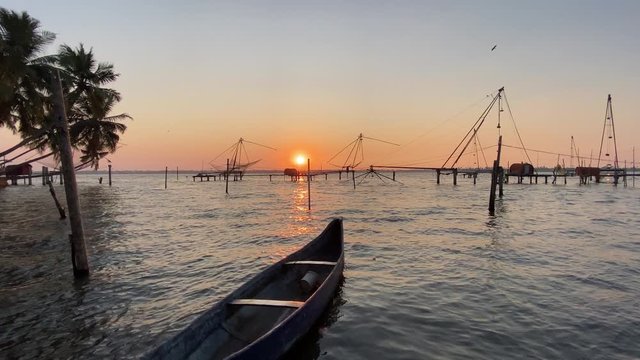 Landscape shot of a lake at magic hour with a boat in foreground