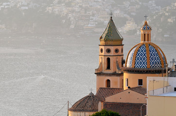 Praiano, The majolica dome of the Church of San Gennaro, against the backdrop of the Positano marina. campania, Italy. 