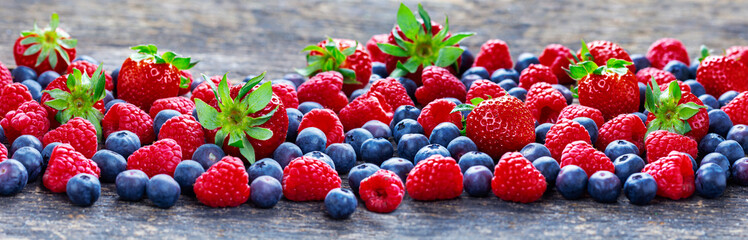 Berries background banner with strawberries, raspberries, blueberries