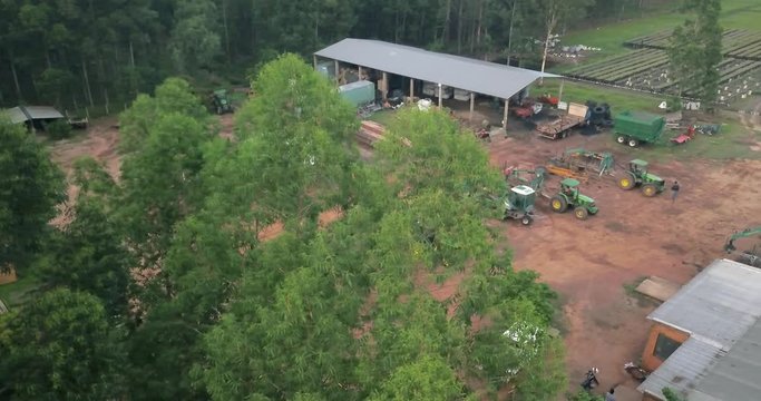 Aerial View of Woodwork Factory Storehouse and Machines by Deciduous Forest in Paraguay Countryside