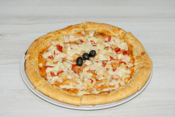 pizza with peppers and mushrooms, sesame and olives