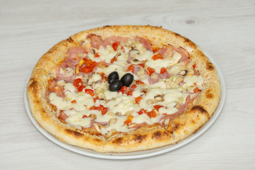pizza with peppers and mushrooms, sesame and olives