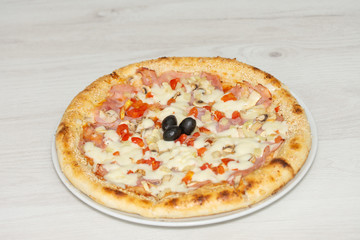 pizza with peppers and mushrooms, sesame and olives