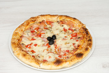 pizza with peppers and mushrooms, sesame and olives