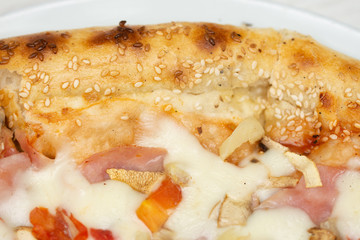 pizza with peppers and mushrooms, sesame and olives