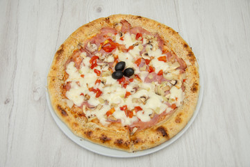 pizza with peppers and mushrooms, sesame and olives