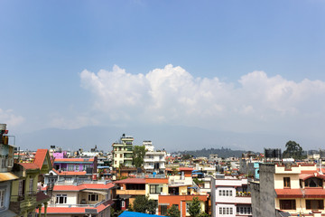 Beautiful houses with balconies, potted flowers and cozy wall colors