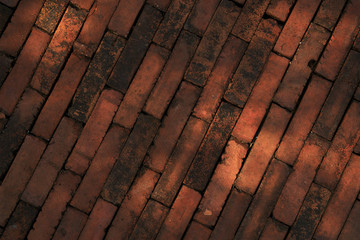 Background of the rough orange brick wall