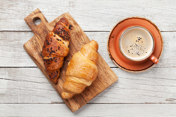 Breakfast with coffee and croissant