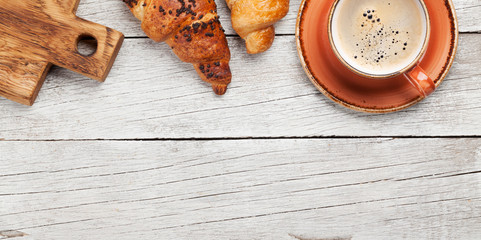 Breakfast with coffee and croissant