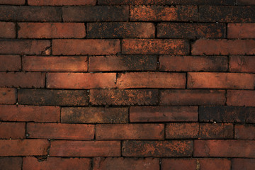 Background of the rough orange brick wall
