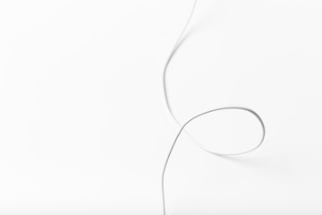 white new wire cable isolated on a white background abstraction.