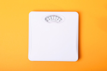 floor scales on a colored background top view.