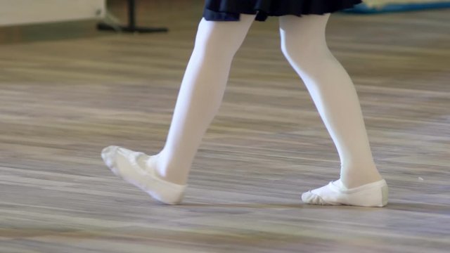 closeup. feet of children in ballet shoes at a ballroom dance rehearsal