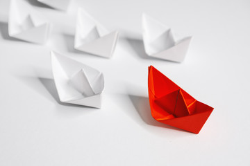 Leadership. Unique Paper Boat Leading The Rest.