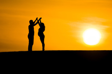 Couple silhouette giving love each other