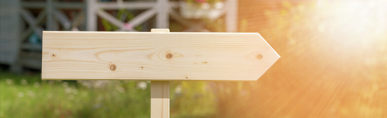 Wooden noticeboard, lettering, sign with a bouquet of wildflowers