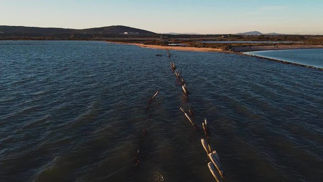 Drone images of the coastline in the étang de Vic at sunset, Vic la Gardiole, Languedoc-Roussillon, France, Europe.