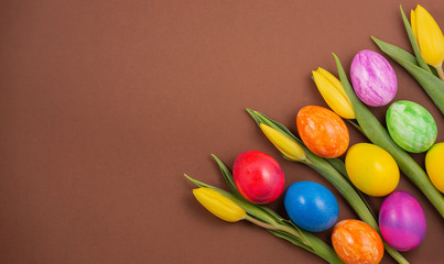 Beautiful group Easter eggs in the spring of easter day, red eggs, blue, purple and yellow on the brown background