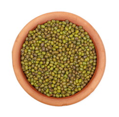 Organic raw green beans mungo in clay pot (Vigna radiata) isolated on white background, top view