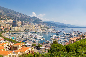 Panoramic view of Fontvieille and harbor with boats, luxury yachts in principality of Monaco, southern France