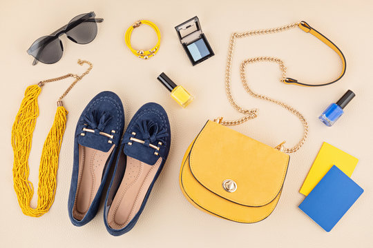 Flat lay with woman fashion accessories in yellow and blue colors. Fashion blog, summer style, shopping and trends idea