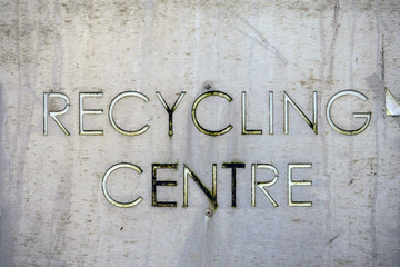 Old worn metal sign recycling center. Concept ecology,