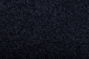 Carpet covering background. Pattern and texture of black colour carpet. Copy space