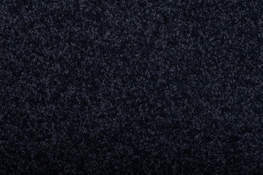 Carpet covering background. Pattern and texture of black colour carpet. Copy space