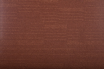 Carpet covering background. Pattern and texture of brown colour carpet. Copy space