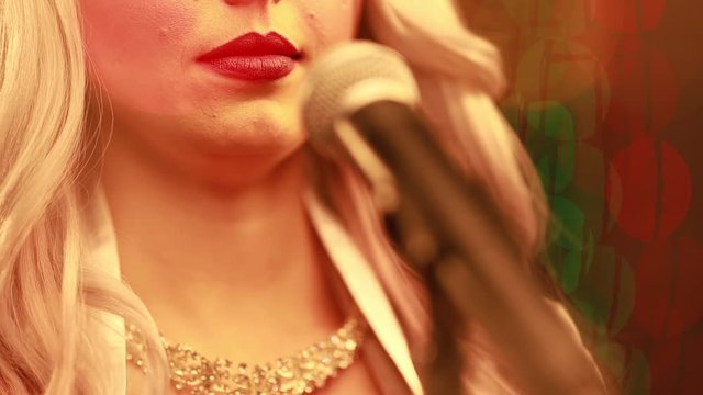 Video clip young woman singer in a New Year&rsquo;s costume Snow Maiden sings a song in stage light