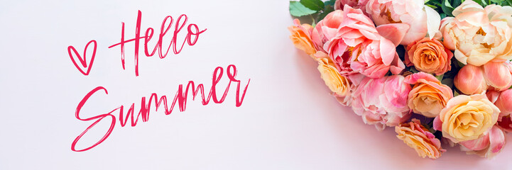 Hello Summer words. Fresh bunch of pink peonies and roses on pink background. Card Concept, pastel colors, close up image, copy space, banner size