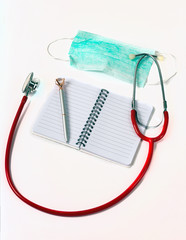 stethoscope and clipboard with a pen