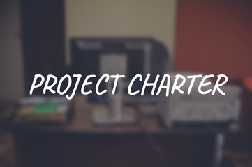 Project charter word with blurring business background