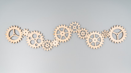 A set of gears made of natural wood puzzle. Stacked into a single mechanism