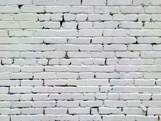 Painted brick wall of an architectural structure in light gray color. Fashionable texture for design.