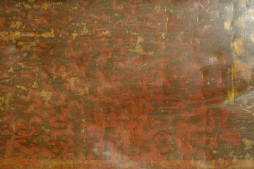 Brown abstract background with rough texture. The texture of the copper background is covered with a patina